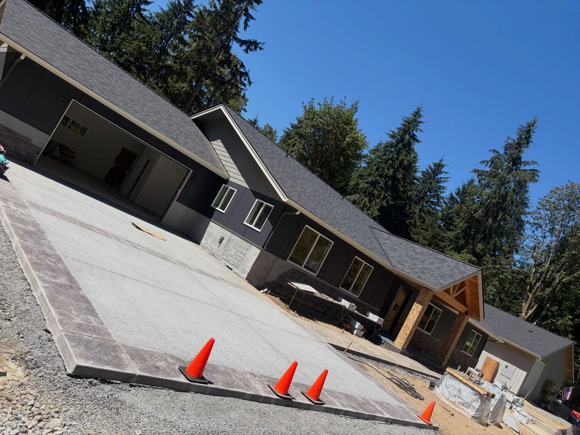 Exposed aggregate driveway stamped border new ranch home