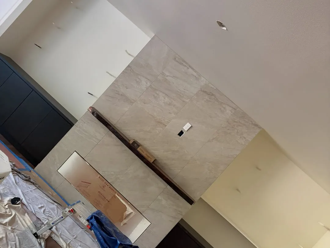 Large format tile fireplace surround interior remodel