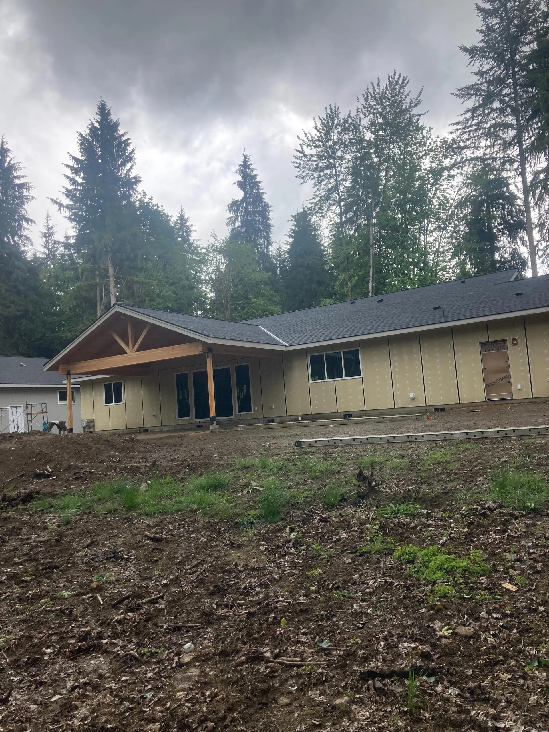 Rear view timber covered patio gable unfinished ranch