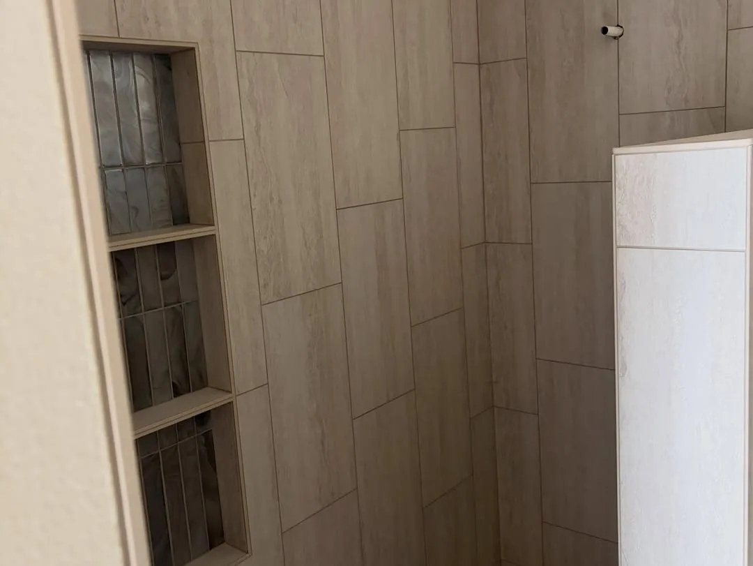 Tiled shower niche glass accent tile remodel